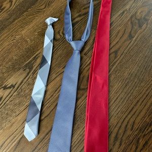 3 ties, one clip on (gray), one Dockers (blue), one Chaps (red).